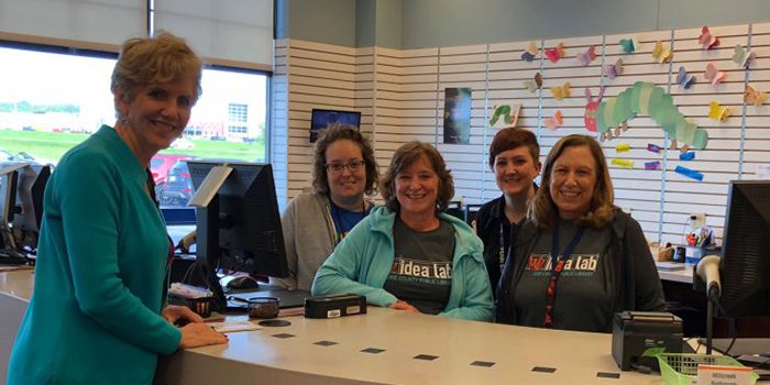 County Executive and library staff inside the Millcreek Branch Library